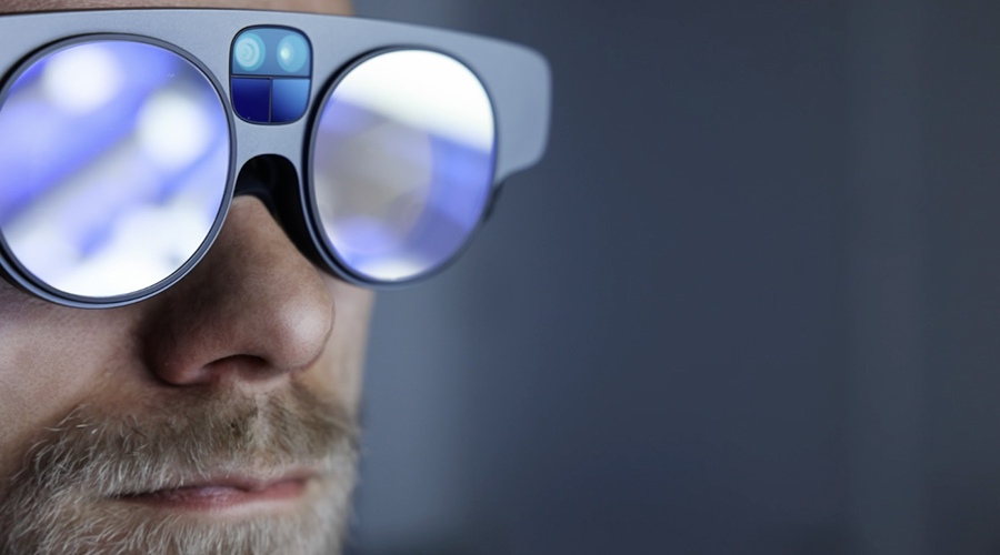 Male wearing Magic Leap 2 AR headset. 